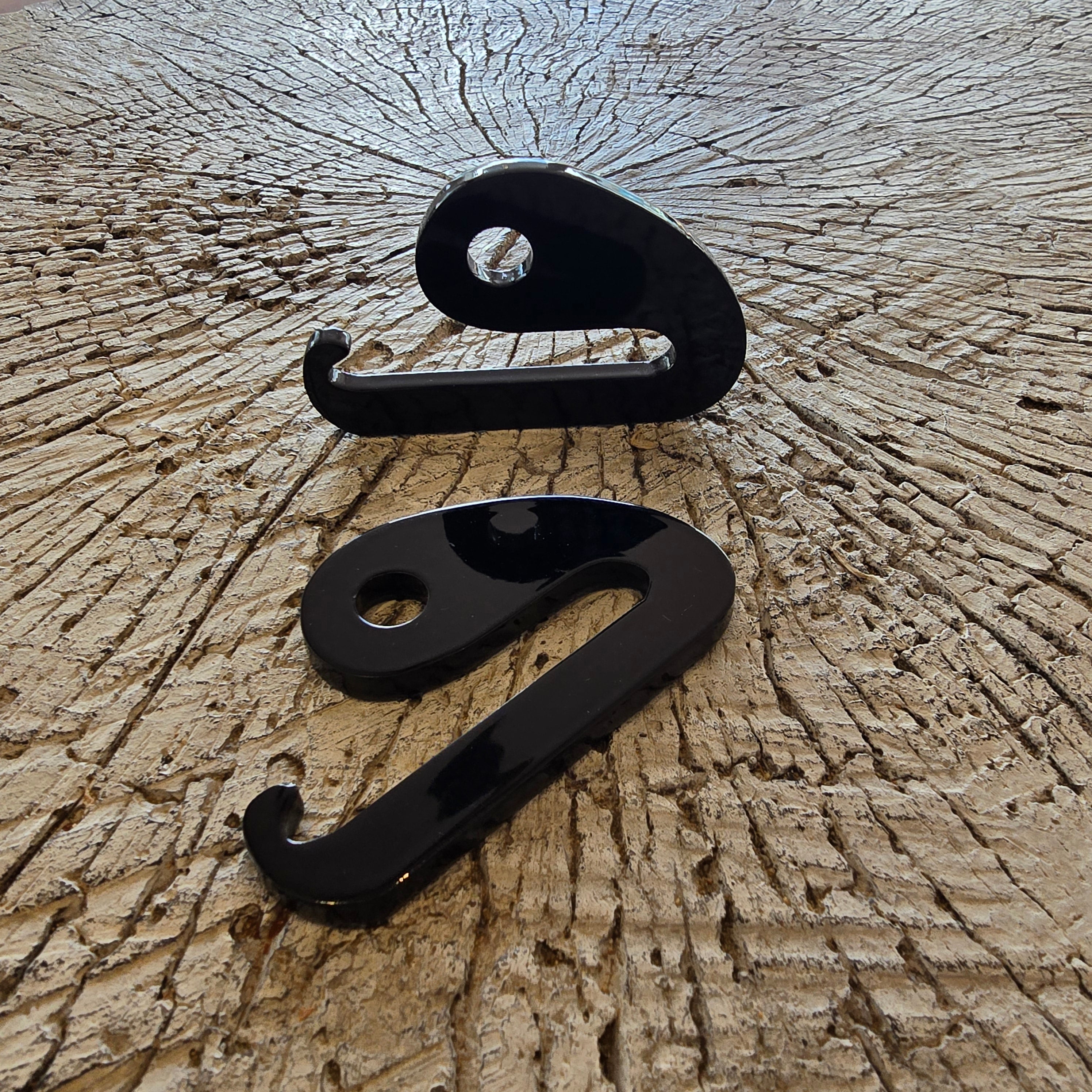 Load video: Demonstration of the Band Buddy by T2Fit showing resistance band workouts using multiple cable attachments like handles, bars, and ankle straps. The fitness tool enhances home and gym exercises by allowing various attachments to connect to resistance loops for full-body strength training.